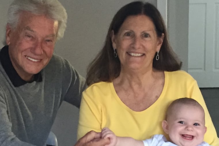 Susan Kardevan Chapman and her partner Tim Bennett, along with his grandchild.