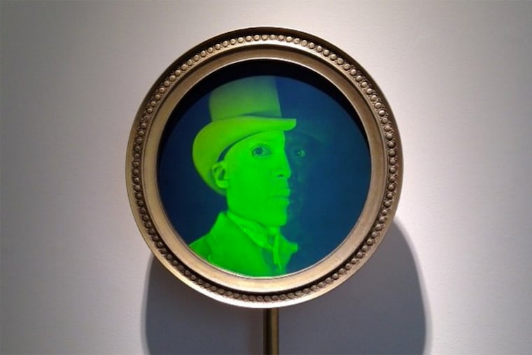 Hank Willis Thomas, Envoy, 2013 mixed media (hologram) 61 x 17 1/2 x 4 5/8 inches.