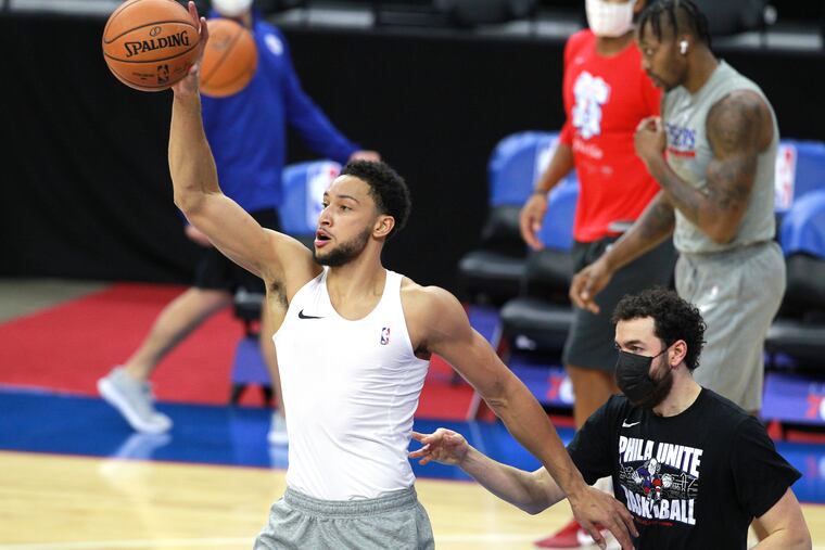 Ben Simmons (left) warms up before a preseason game against the Celtics on Dec. 15. Simmons has been the subject of trade rumors.