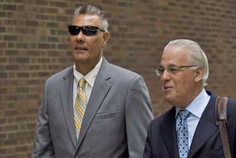 Leonard Luchko, left, former aide to state Sen. Vincent Fumo, leaves the federal courthouse with his lawyer, James Schwartzman, on Monday. (Justin Maxon/Associated Press)