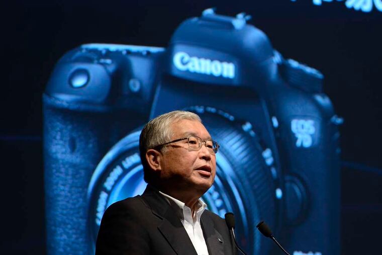 Masami Kawasaki, president of Canon Marketing Japan Inc., speaks during the unveiling in Tokyo on Tuesday of Canon's new EOS 7D Mark II digital single lens reflex camera. Canon, the world's largest camera maker, announced that the EOS 7D Mark II will go on sale in November. The new EOS model features a range of new technology, including rapid-burst shooting of up to 10 frames per second.