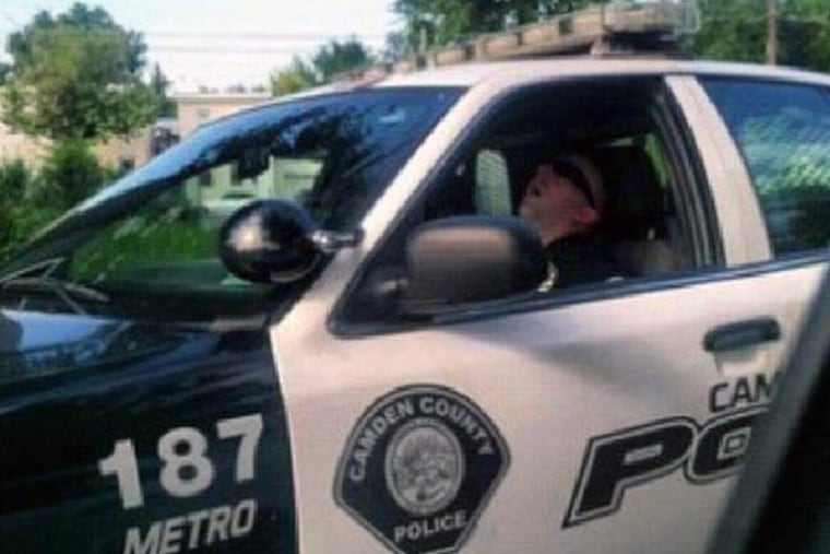 This photo, apparently taken by a Camden resident and being shared on the Internet this week, appears to show an unidentified officer of the new Camden County Police Department fast asleep inside his cruiser. Police Chef Scott Thomson says he is investigating.