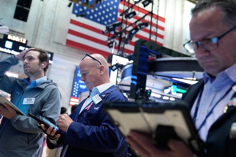Traders work on the floor at the New York Stock Exchange in New York, Monday, July 6, 2026. (AP Photo/Seth Wenig)