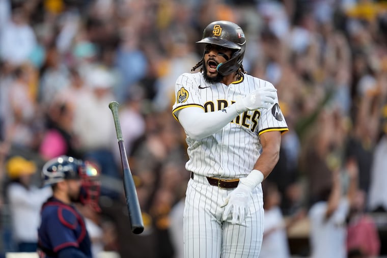 Fernando Tatis Jr. tosses his bat after hitting a two-run home run during the first inning in Game 1 of the NL wild-card series game against the Atlanta Braves.