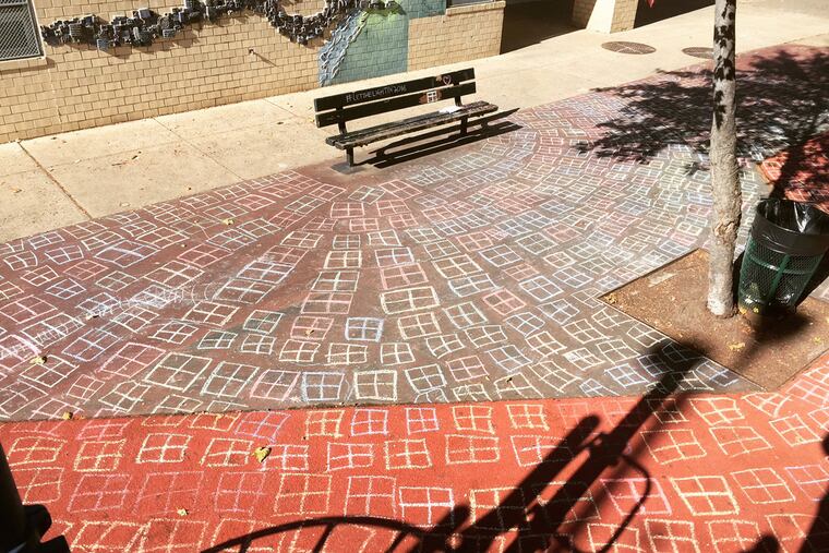 Shissler Rec Center in Fishtown with chalk windows, symbolizing the co-opting of swastikas for the concept “Let in the Light.”