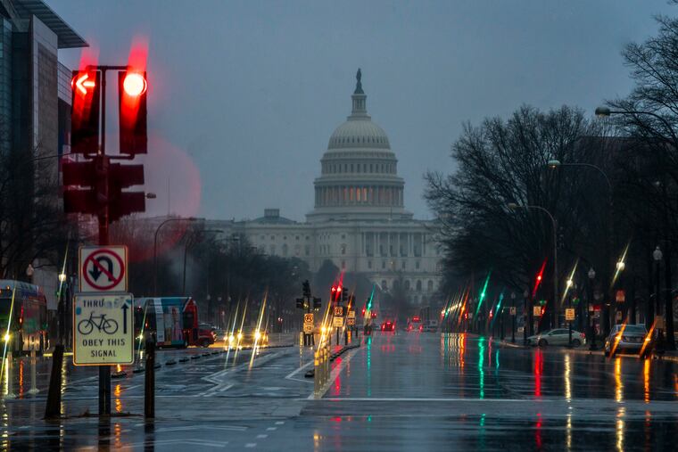 The Capitol is seen on a rainy morning in Washington, Friday, Dec. 28, 2018, during a partial government shutdown. President Donald Trump is threatening to close the U.S. border with Mexico if Democrats in Congress don't agree to fund the construction of a border wall.