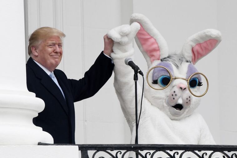 President Trump holds hands with the Easter Bunny during the 140th Easter Egg Roll on Monday, April 2, 2018, on the South Lawn of the White House.