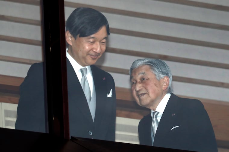Japan's Emperor Akihito (right), accompanied by Crown Prince Naruhito.