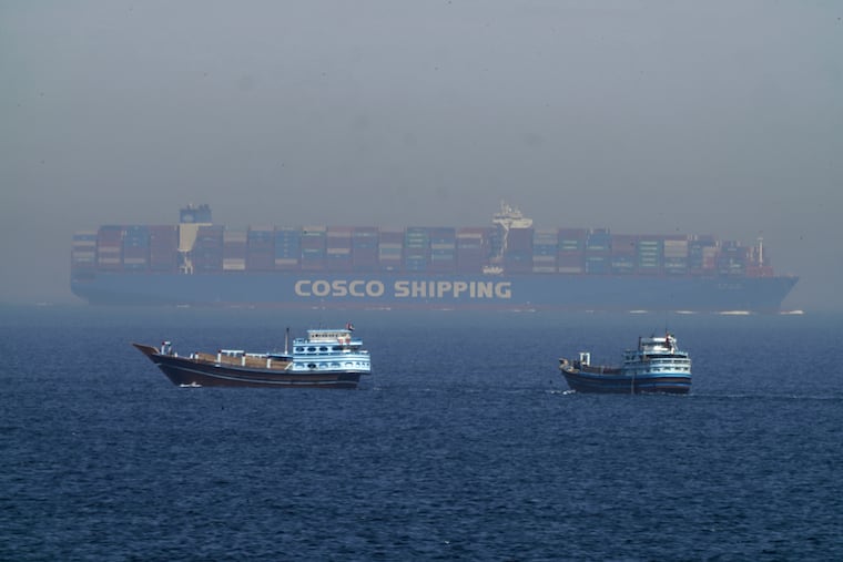 A large container ship in the Strait of Hormuz, between the Persian Gulf and the Gulf of Oman, in 2023. Amid the Iran war, cargo ships are stuck in the area or making a much longer detour around the southern tip of Africa.