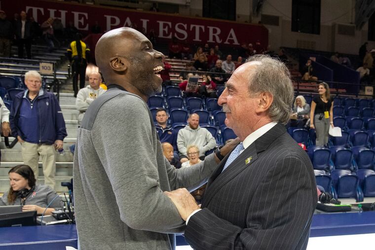 Coach Fran Dunphy of La Salle greets coach Aaron McKie of Temple before their teams' game on Wednesday at the Palestra.