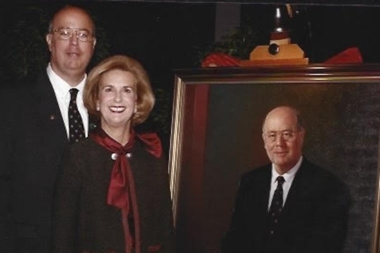 Dr. Abrams and his wife, Nancy, stand by his portrait that hangs at Thomas Jefferson University.