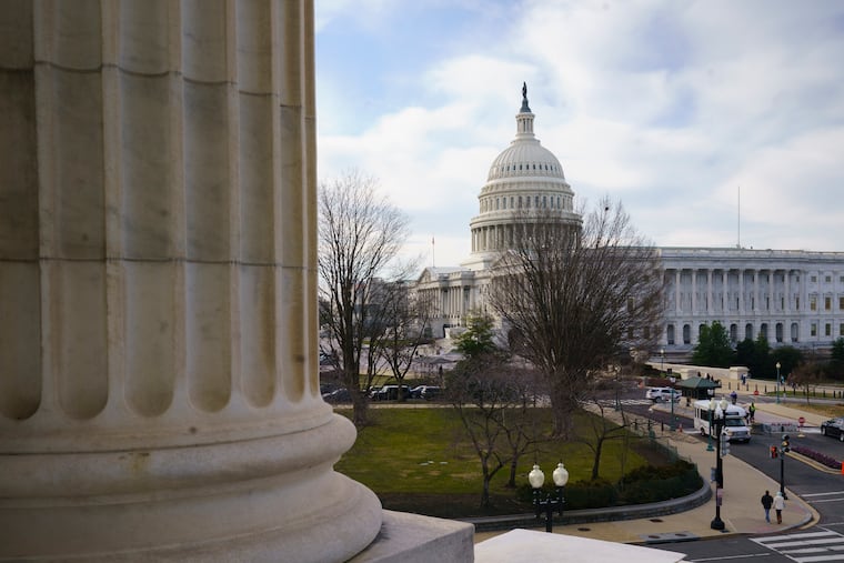 The Capitol is seen as defense arguments by the Republicans resume in the impeachment trial of President Donald Trump on charges of abuse of power and obstruction of Congress, in Washington, Monday, Jan. 27, 2020.