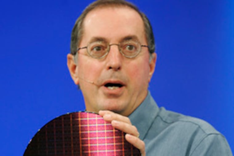 A replica of the first transistor (left), built 60 years ago. Paul Otellini, Intel Corp. CEO, holds a wafer of chips with billions of transistors.