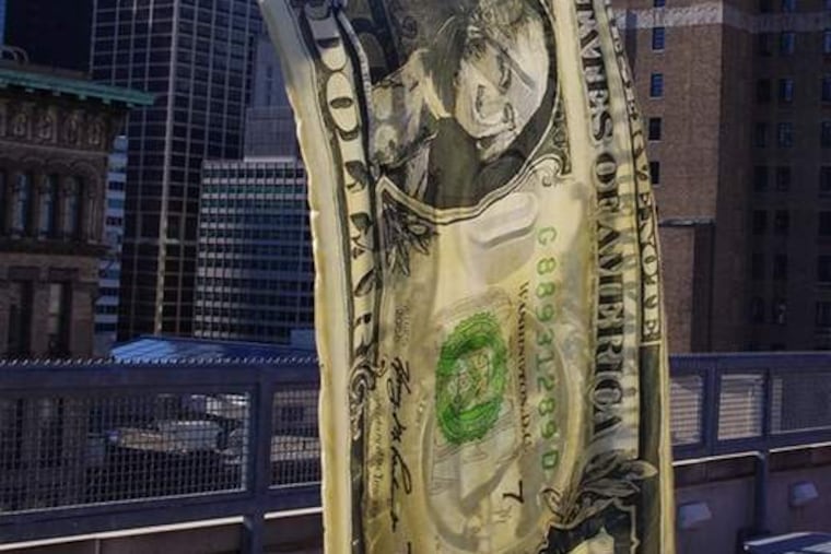 Emily Erb's "American Flag," a work incorporating dye, silk, and a flagpole. The show at Little Berlin features about 20 writer-artists.