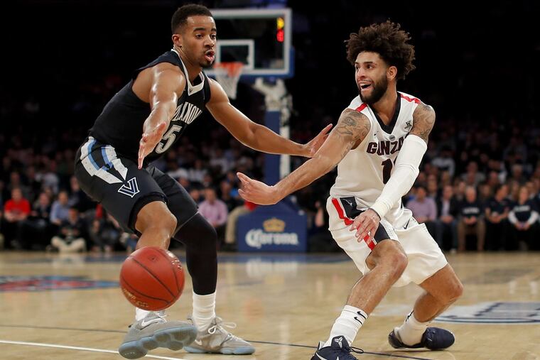 Phil Booth, one of the former redshirts for Villanova, defends Gonzaga guard Josh Perkins (13) during the first half Tuesday.