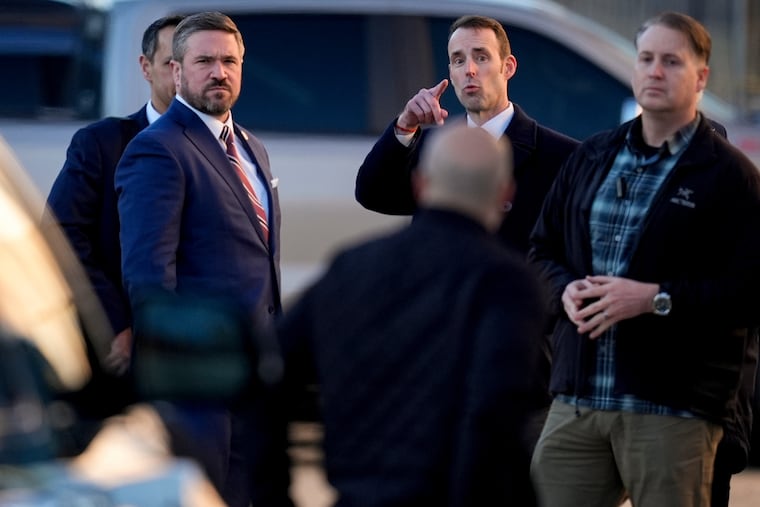 FBI Deputy Director Andrew Bailey, right, stands with members of the FBI at the Fulton County Elction HUB, Wednesday, Jan. 28, 2026, in Union City, Ga., near Atlanta.
