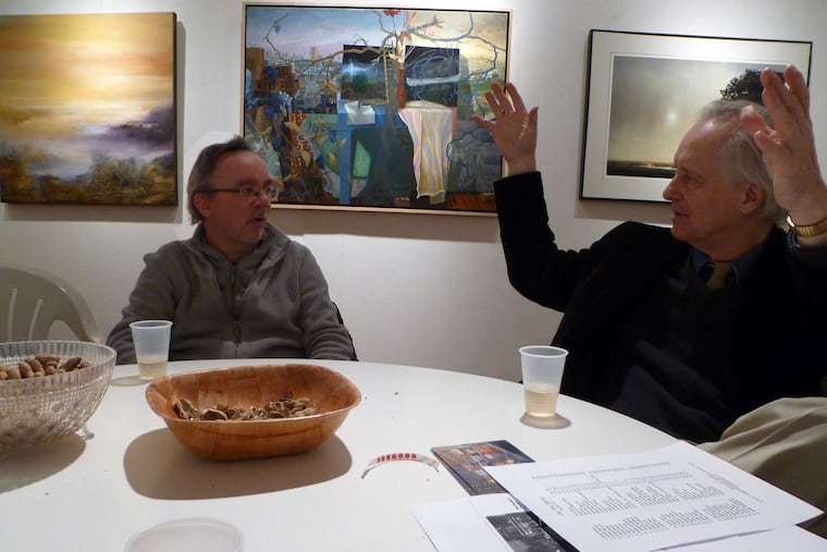 Rodger LaPelle (on the right) makes a point in conversation with artist Joe Naujokas at the LaPelle Gallery.