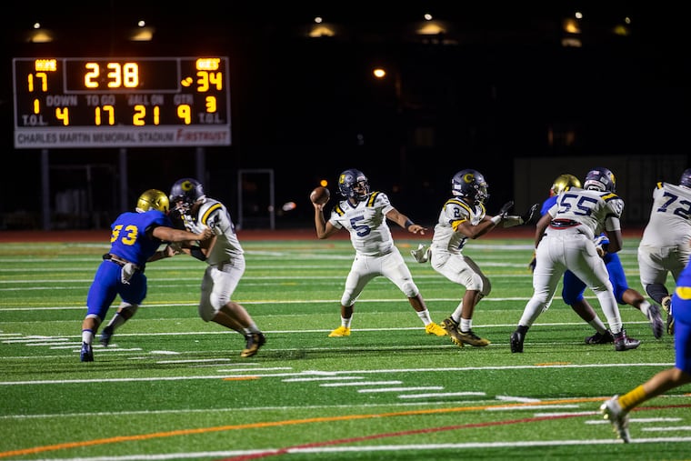 Cheltenham quarterback Adonis Hunter (5) fires off a pass in the Panthers' 34-17 win over Frankford at Northeast High on Thursday.