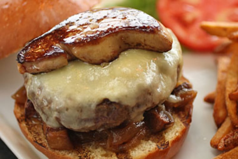 The burger - ground brisket with foie gras - is one of the jewels at Adsum, Matt Levin's new bistro in Queen Village. (MICHAEL BRYANT / Staff Photographer)