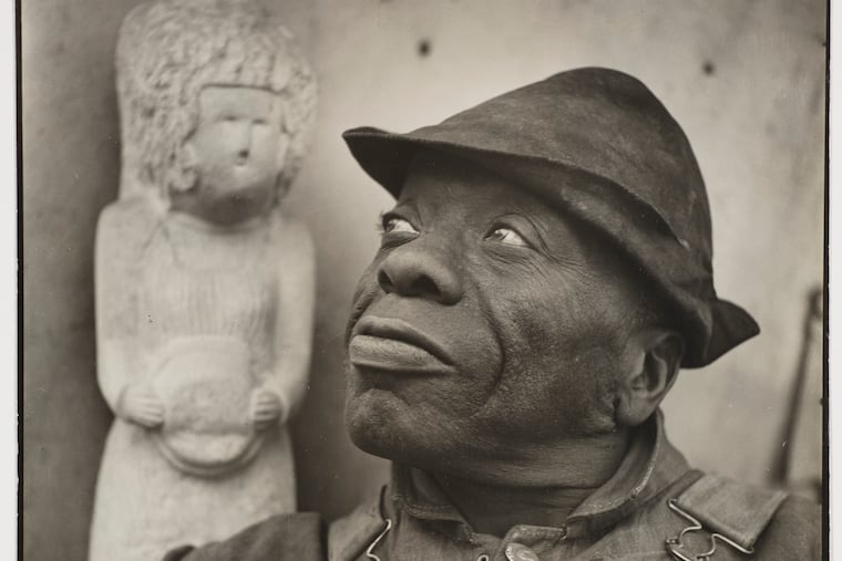 "William Edmondson with 'Miss Louisa,'" 1937. Cheekwood Estate and Gardens, Nashville. Photograph by Louise Dahl-Wolfe © Center for Creative Photography, Arizona Board of Regents.