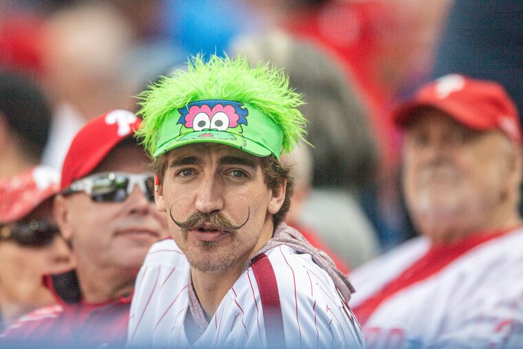 Phillies fans watch the game during the fourth inning of opening day against the Oakland Athletics at Citizens Bank Park on Friday.