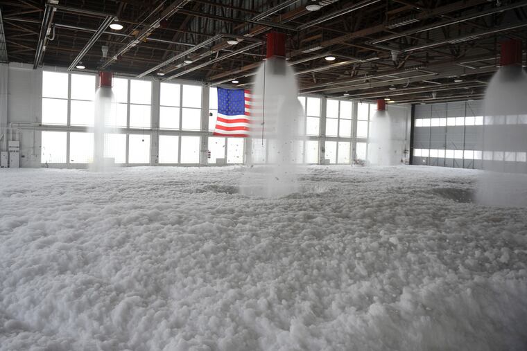 Firefighting foam fills Hangar 211 at Mountain Home Air Force Base, Idaho, Dec. 21, 2012. The Trump administration objects to a provision in a House defense spending bill that would require the military to phase out firefighting foam containing PFAS chemicals, which have tainted drinking water across the country, by 2025. Photo: U.S. Air Force.