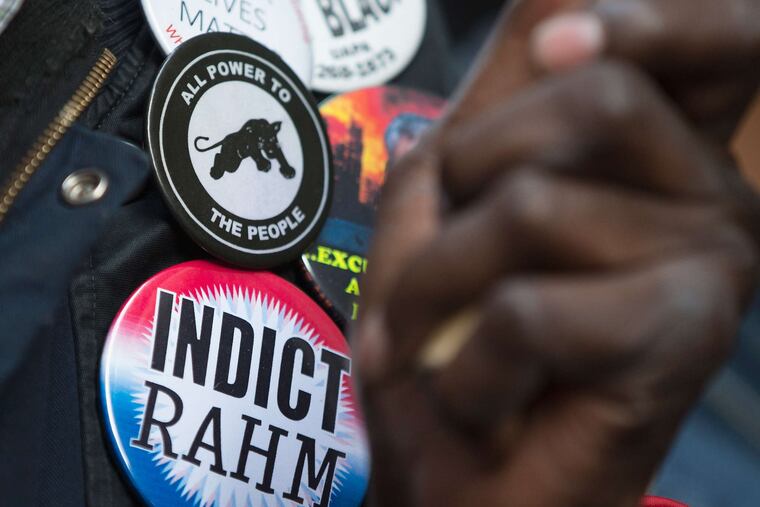 Buttons carry the Chicago protest message. Some activists wore T-shirts that read "Rahm Failed Us."