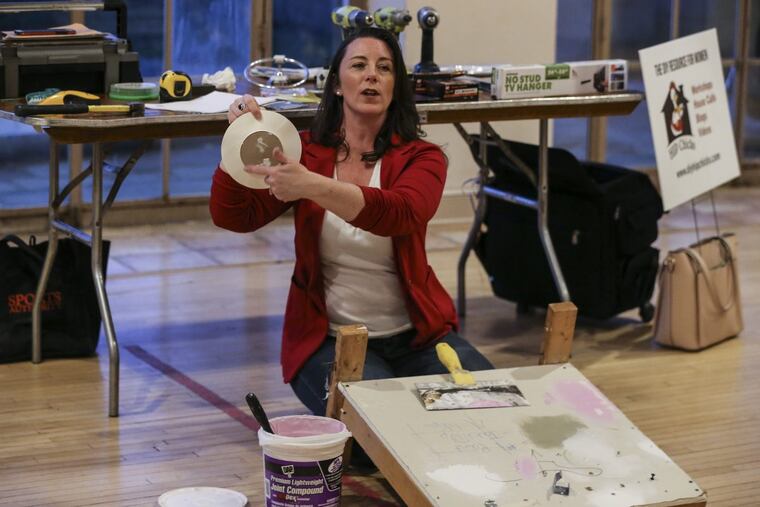 Handywoman Beth Allen talks about a doorknob drywall repair patch at Bucks County Community College.