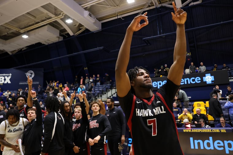 St. Joe's forward Dasear Haskins (7) waves to the student section following Saturday's road win against La Salle at John Glaser Arena.
