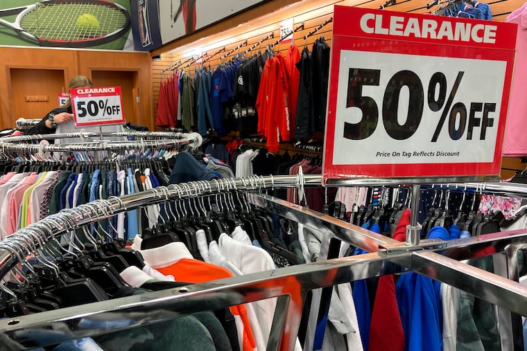 Clearance sale signs are displayed at a retail store in Downers Grove, Ill., in April.