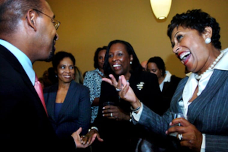 Nutter greets Beverly Muldrow (right) and other supporters at the "Women for Nutter" fund-raiser.