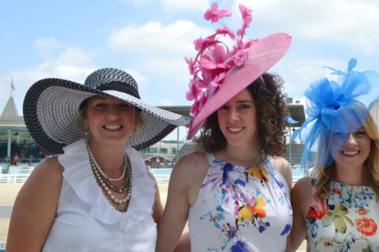 A colorful mix of hats atop (from left) Elizabeth Hunt, Gabrielle Aruta, Priscilla Person, and Meg Cinelli at the 2015 Ladies Day Hat Contest.