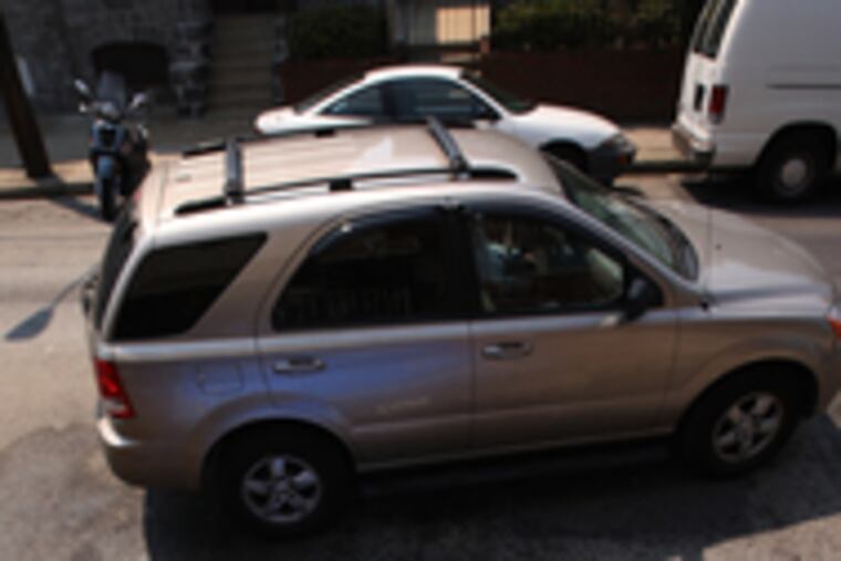 Dennis Kurinskas, 8, floats in a South Second Street pool, which has beena big hit since it was put out Sunday.