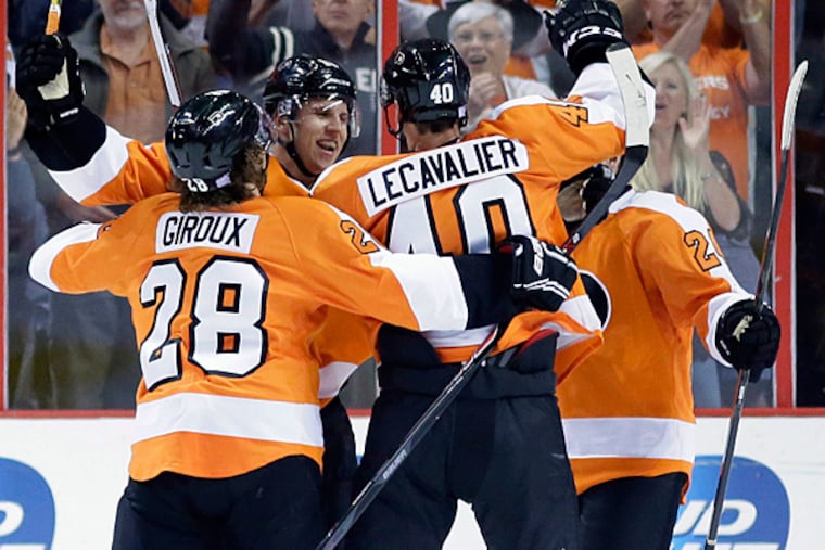The Philadelphia Flyers celebrate after scoring a goal. (Matt Slocum/AP)