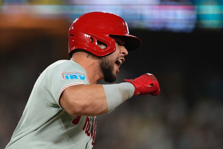 Phillies catcher Rafael Marchán celebrates after hitting a three-run home run during the ninth inning against the Dodgers on Tuesday night.