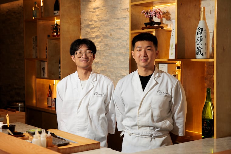 Head chefs Leo Liu, left, and Ming Lee, right, posed for a portrait at Oroshi on Thursday, July 16, 2026 in Philadelphia. Oroshi offers a $68 omakase.