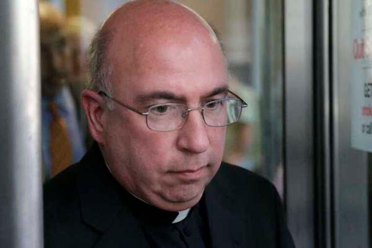 The Rev. Andrew McCormick exits the Criminal Justice Center after a hearing, Thursday, Aug. 16, 2012, in Philadelphia. McCormick who is accused of sexually abusing a 10-year-old boy inside a rectory bedroom in 1997 faces misdemeanor counts of endangerment and indecent assault. (AP Photo/Matt Rourke)