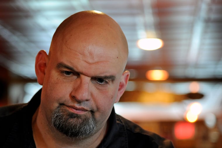 Braddock Mayor John Fetterman (left) campaigns for the Democratic Senate nomination at Fishtown’s Interstate Drafthouse. He hopes authenticity triumphs.