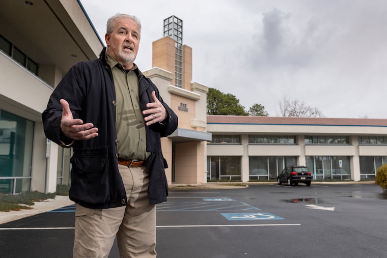 Developer Kevin Dixon is renting the building behind him to Camelot Educational Resources, a school for troubled youth in Galloway, N.J.