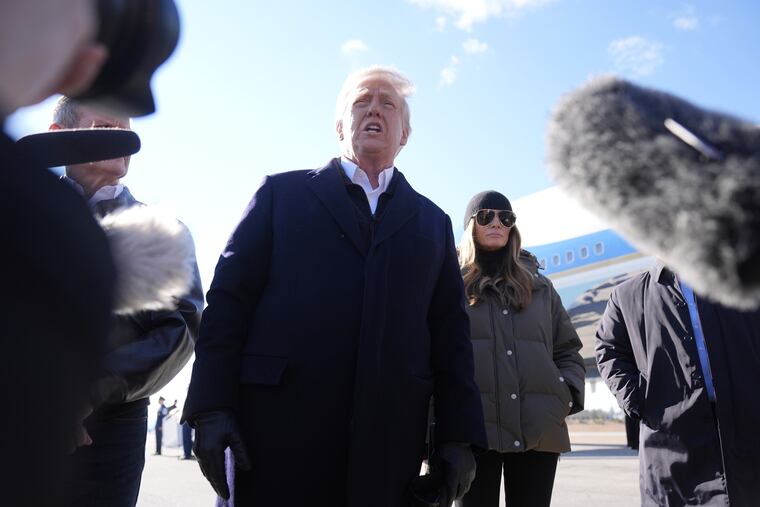President Donald Trump speaks to the media after he and first lady Melania Trump stepped off Air Force One upon their arrival at Asheville Regional Airport in Fletcher, N.C., Friday, Jan. 24, 2025.