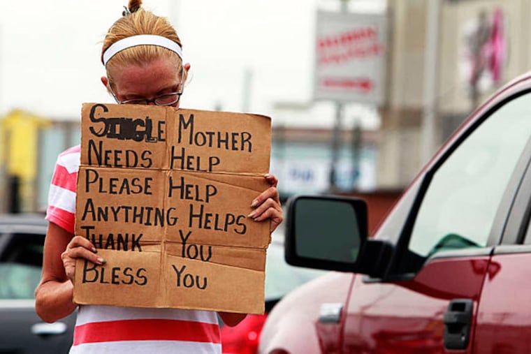 Samantha, 35 from South Philly is panhandling at Pier 70 Blvd & Columbus Blvd on South Philly. July 12, 2013 ( AKIRA SUWA / Staff Photographer )