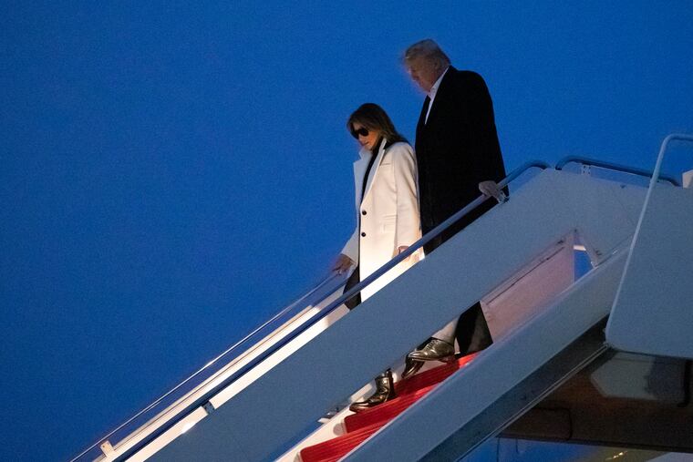 President Donald Trump, and first lady Melania Trump, step off Air Force One upon arrival, Wednesday, Feb. 26, 2020, at Andrews Air Force Base, Md. Trump is returning from India.