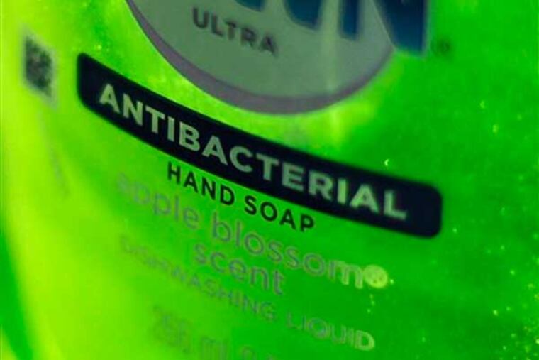 This Tuesday, April 30, 2013, photo, shows Dawn Ultra antibacterial soap in a kitchen Tuesday in Chicago. Federal health regulators are deciding whether triclosan, the germ-killing ingredient found in an estimated 75 percent of anti-bacterial liquid soaps and body washes sold in the U.S. is harmful. The ruling, which will determine whether triclosan continues to be used in household cleaners, could have broader implications for a $1 billion industry that includes hundreds of anti-bacterial products from toothpaste to toys (AP Photo/Kiichiro Sato)