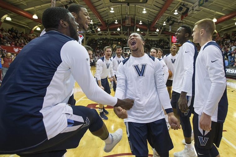 Jalen Brunson, center, of Villanova leads his team in a pre-game ritual before a game against St. Joseph's on Saturday.