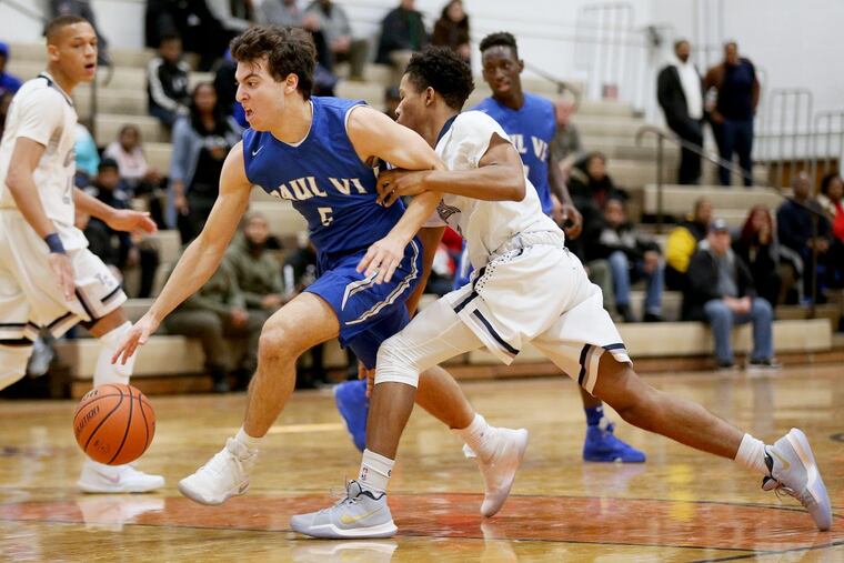 Paul VI’s Nick Villa (5) drives past Timber Creek’s Sean Miller (11) on Saturday.