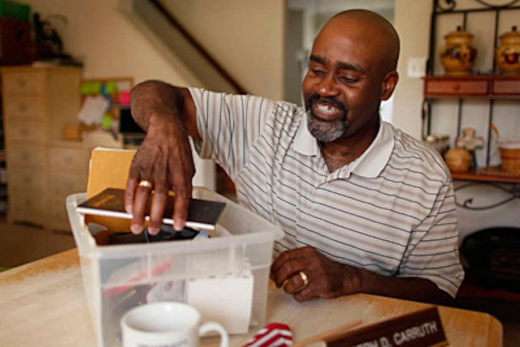 Joseph Carruth goes through stored things from his office when he was a principal at Dr. Charles E. Brimm Medical Arts High School in Camden. Carruth was terminated in 2006 but has been reinstated by the school district.