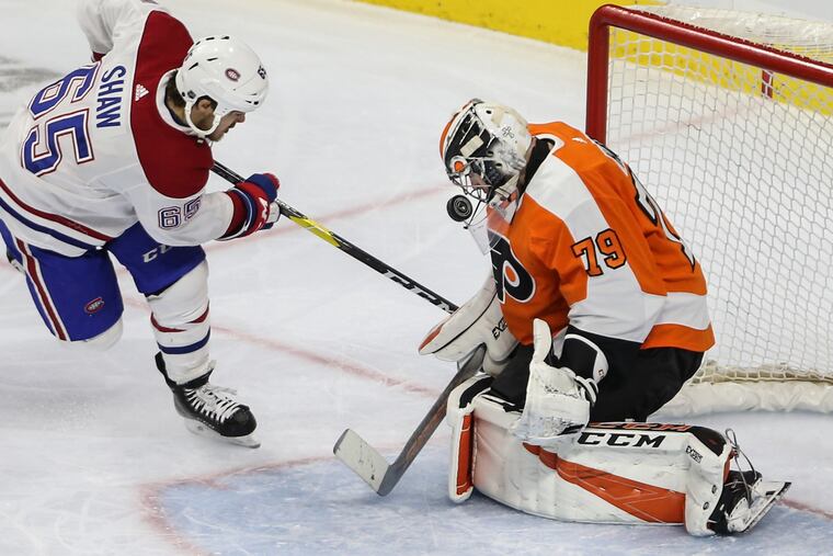 Flyers' goalie Carter Hart stops the shot of Canadiens' Andrew Shaw during the third period at the Wells Fargo Center, Tuesday, March 19, 2019. The Canadiens beat the Flyers 3-1.