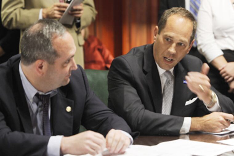 Sen. Chuck McIlhinney, R-Bucks, left and Senate President Pro Tempore Joe Scarnati, R-Jefferson, right, address a Rules Committee meeting with fellow lawmakers in working through details of a bill related to the state budget Thursday, June 30, 2011 in Harrisburg, Pa. (AP Photo/Bradley C Bower)