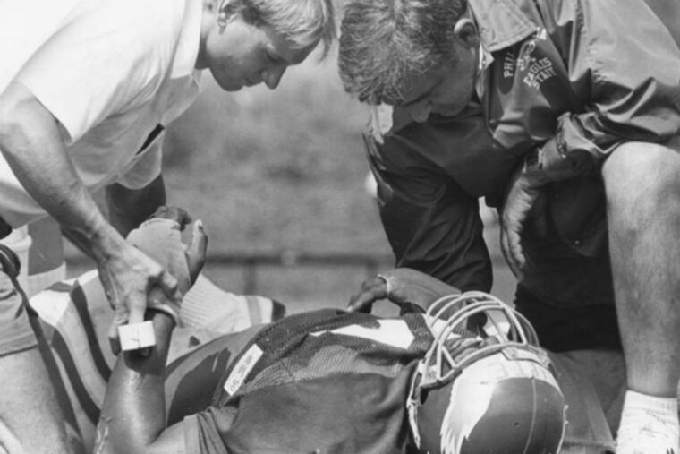 (FILE PHOTO Even the great Reggie White collapsed during Buddy Ryan's brutal first camp.)