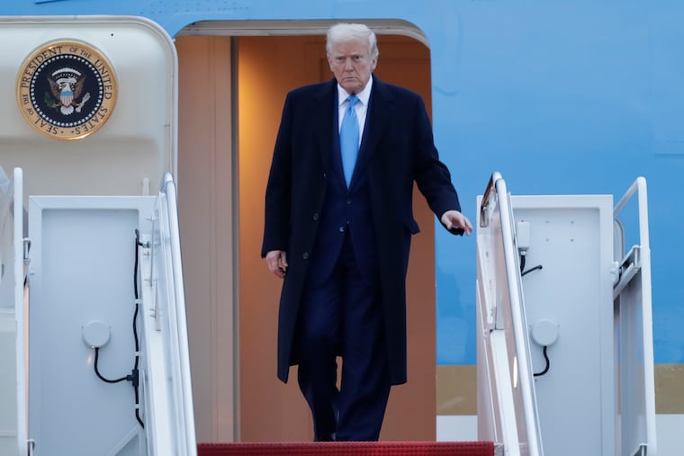 President Donald Trump walks down the stairs of Air Force One upon his arrival at Joint Base Andrews, Md., Sunday, April 6, 2025.